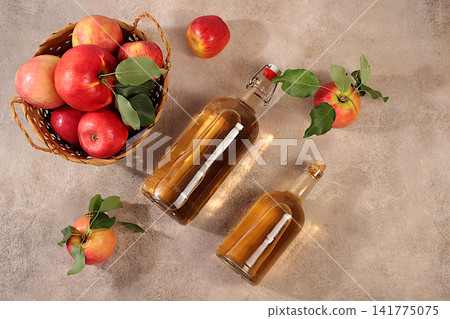 Apple cider with fruit in baskets, Thanksgiving decorations and country harvest, healthy natural food and home canning concept, long-term storage at home, banner for a screen, business card for cafe Apple cider with fruit in baskets, Thanksgiving decorations and country harvest, healthy natural food and home canning concept, long-term storage at home, banner for a screen, business card for cafe 141775075