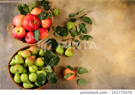 Apples and pears in baskets on a sunlit concrete table, Thanksgiving background, rustic harvest, healthy natural food concept, detox diet and body cleansing, banner for screen, business card for cafe Apples and pears in baskets on a sunlit concrete table, Thanksgiving background, rustic harvest, healthy natural food concept, detox diet and body cleansing, banner for screen, business card for cafe 141775079