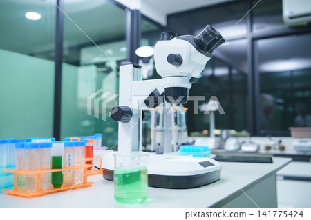 Laboratory Setup with Microscope and Test Tubes for Research and Analysis Laboratory Setup with Microscope and Test Tubes for Research and Analysis 141775424