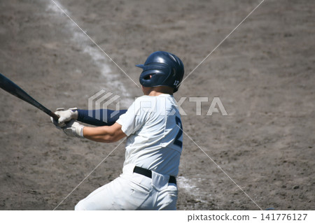 Batter hitting the ball Batter hitting the ball 141776127