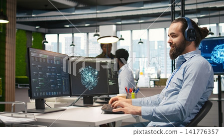 Programmer testing generative AI machine learning algorithms and listening music at work. IT expert wearing headphones scaling productivity with AI large language model written code, camera A Programmer testing generative AI machine learning algorithms and listening music at work. IT expert wearing headphones scaling productivity with AI large language model written code, camera A 141776357