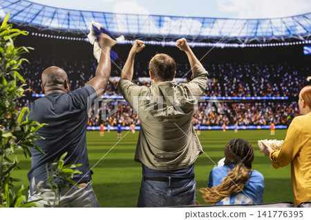 High fidelity football broadcasting transporting viewers in stadium, waving team scarves. Back view of soccer fans feeling immersed in stadium experience, cheering for players High fidelity football broadcasting transporting viewers in stadium, waving team scarves. Back view of soccer fans feeling immersed in stadium experience, cheering for players 141776395