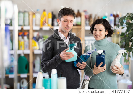 Husband and wife choose a spray for surfaces Husband and wife choose a spray for surfaces 141777307