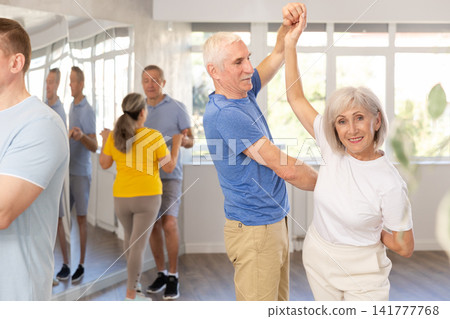 Couple of elderly man and woman dancing waltz Couple of elderly man and woman dancing waltz 141777768