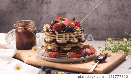 Pancakes with fruits and chocolate sauce Pancakes with fruits and chocolate sauce 141777830