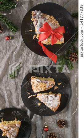 Festive Bolo Rainha slices on dark plates 141777839