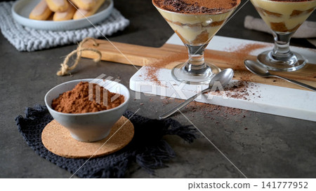 Traditional Italian Tiramisu Served in Elegant Glass Cups 141777952