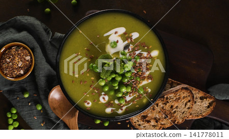 Overhead View of Green Pea Soup with Flaxseeds and Toasted Bread Overhead View of Green Pea Soup with Flaxseeds and Toasted Bread 141778011