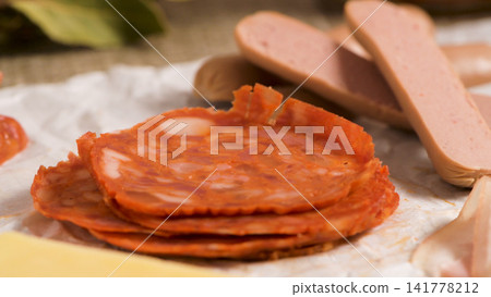 Sliced Chorizo and Sliced Frankfurters on Crumpled White Paper Sliced Chorizo and Sliced Frankfurters on Crumpled White Paper 141778212