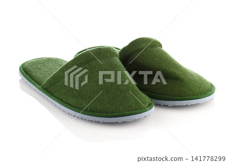 A pair of green slippers 141778299