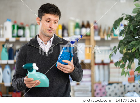 European man chooses a spray European man chooses a spray 141779261