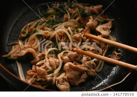 Pork chive bean sprouts being cooked Pork chive bean sprouts being cooked 141779559