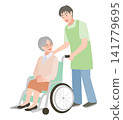 A caregiver pushing a wheelchair 141779695