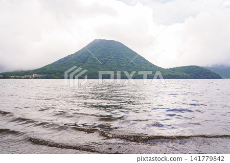 A summer view of Mount Haruna (Fuji) from the shores of Lake Haruna, a popular tourist spot in Gunma Prefecture. A summer view of Mount Haruna (Fuji) from the shores of Lake Haruna, a popular tourist spot in Gunma Prefecture. 141779842