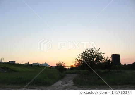 Scenery at sunset, from the riverbank. Scenery at sunset, from the riverbank. 141780374