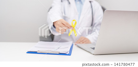 Doctor with Gold Yellow Ribbon for concept of September Childhood cancer Awareness month, July Sarcoma, bone and bladder cancer, support survivor. Healthcare and World Cancer day Doctor with Gold Yellow Ribbon for concept of September Childhood cancer Awareness month, July Sarcoma, bone and bladder cancer, support survivor. Healthcare and World Cancer day 141780477