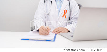 Professional doctor using laptop and writing notes for February World Cancer Day, September Leukemia, March Kidney, August Appendix, Multiple Sclerosis, November CRPS and COPD disease concept Professional doctor using laptop and writing notes for February World Cancer Day, September Leukemia, March Kidney, August Appendix, Multiple Sclerosis, November CRPS and COPD disease concept 141780496