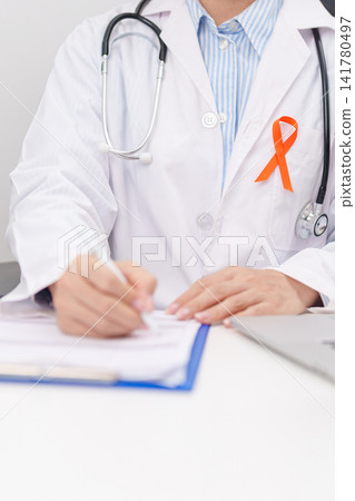 Professional doctor using laptop and writing notes for February World Cancer Day, September Leukemia, March Kidney, August Appendix, Multiple Sclerosis, November CRPS and COPD disease concept Professional doctor using laptop and writing notes for February World Cancer Day, September Leukemia, March Kidney, August Appendix, Multiple Sclerosis, November CRPS and COPD disease concept 141780497