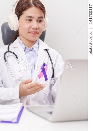 doctor using laptop for telehealth, online consultation and meeting about purple and pink ribbon concept of September Thyroid Cancer Awareness month, Healthcare and February world cancer day doctor using laptop for telehealth, online consultation and meeting about purple and pink ribbon concept of September Thyroid Cancer Awareness month, Healthcare and February world cancer day 141780517