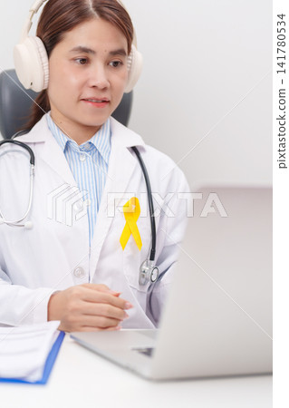 Professional doctor using laptop for telehealth, online consultation and meeting about Yellow Ribbon concept of yellow September, Suicide prevention day, Childhood, July Sarcoma, bone cancer Professional doctor using laptop for telehealth, online consultation and meeting about Yellow Ribbon concept of yellow September, Suicide prevention day, Childhood, July Sarcoma, bone cancer 141780534