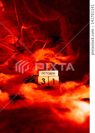 Atmospheric Halloween concept symbolizing arrival of October 31, combining seasonal decoration dramatic lighting and festive tradition Atmospheric Halloween concept symbolizing arrival of October 31, combining seasonal decoration dramatic lighting and festive tradition 141781141