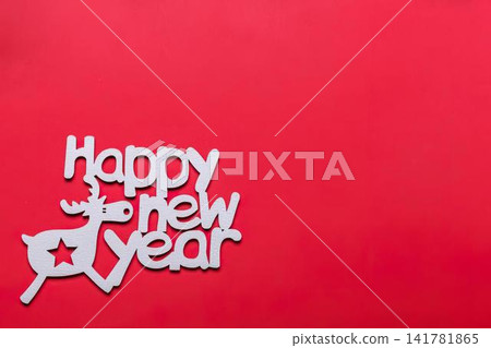Happy new year message with cute reindeer on red background Happy new year message with cute reindeer on red background 141781865