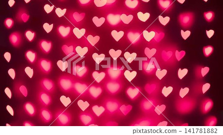 Pink heart-shaped bokeh lights on a dark background 141781882