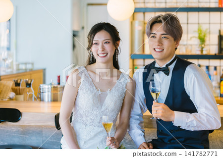 Bride and groom toast with champagne at a wedding. Bride and groom toast with champagne at a wedding. 141782771