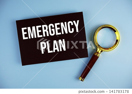 Emergency Plan text with Magnifying glass on blue background Emergency Plan text with Magnifying glass on blue background 141783178