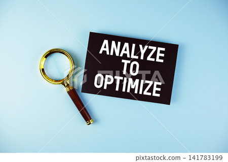 Analyze to Optimize text with Magnifying glass on blue background Analyze to Optimize text with Magnifying glass on blue background 141783199