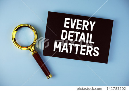 Every Detail Matters text with Magnifying glass on blue background Every Detail Matters text with Magnifying glass on blue background 141783202