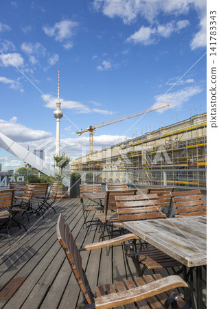 Berlin, Germany - July 01, 2018: Building of the City Palace in Berlin on the background of a TV tower. Berlin, Germany - July 01, 2018: Building of the City Palace in Berlin on the background of a TV tower. 141783343