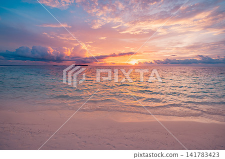 Enchanting pastel sunset over calm tropical sea reflecting warm light on rippled water soft glowing sky. Perfect summer travel seascape paradise coast. Peaceful outdoors wellness wall art scenic Enchanting pastel sunset over calm tropical sea reflecting warm light on rippled water soft glowing sky. Perfect summer travel seascape paradise coast. Peaceful outdoors wellness wall art scenic 141783423