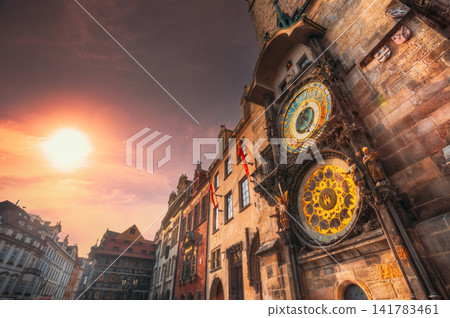 Prague Astronomical Clock illuminated by golden sunset light Prague Astronomical Clock illuminated by golden sunset light 141783461