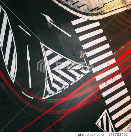 Abstract zebra crossing with red light trails Abstract zebra crossing with red light trails 141783462