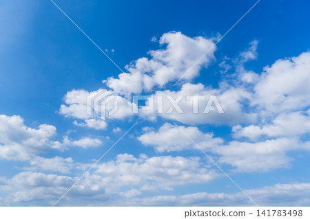 Summer sky on a scorching hot afternoon Summer sky on a scorching hot afternoon 141783498