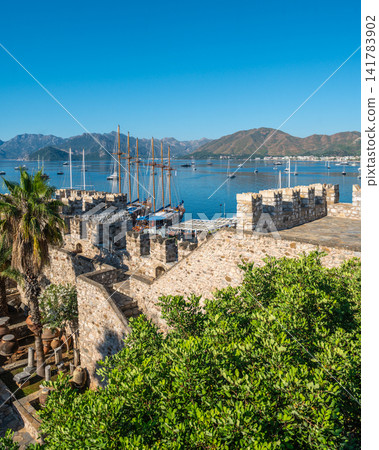 Castle garden and ancient walls overlooking the sea in Marmaris Turkey Castle garden and ancient walls overlooking the sea in Marmaris Turkey 141783902