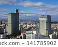 A view of downtown Sendai, with skyscrapers and a blue sky. 141785902