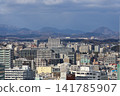 The view from in front of Sendai Station, the cityscape, and the mountains visible in the distance. 141785907