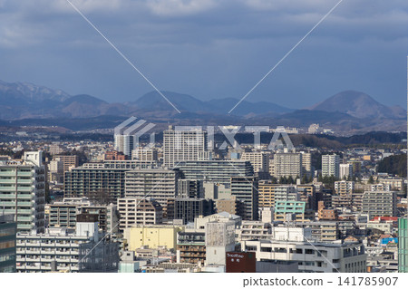 The view from in front of Sendai Station, the cityscape, and the mountains visible in the distance. The view from in front of Sendai Station, the cityscape, and the mountains visible in the distance. 141785907