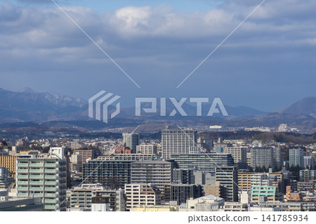 A view of Sendai city and distant mountains. A view of Sendai city and distant mountains. 141785934
