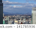 The view from in front of Sendai Station, the cityscape, and the mountains visible in the distance. 141785936