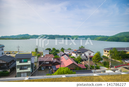 Scenic view of traditional houses by the lake at Hawayi Onsen in Tottori, Japan Scenic view of traditional houses by the lake at Hawayi Onsen in Tottori, Japan 141786227
