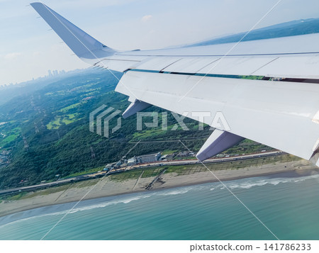 Airplane wing view over Tokyo coastline Airplane wing view over Tokyo coastline 141786233