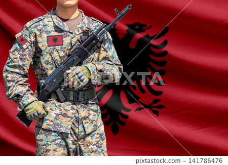 Albania flag with soldier holding assault rifle 141786476