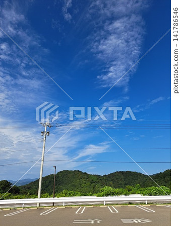 A rural landscape at dusk, with cirrocumulus clouds and the silhouettes of trees. A rural landscape at dusk, with cirrocumulus clouds and the silhouettes of trees. 141786546