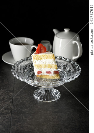 Strawberry shortcake on a cake stand and tea Strawberry shortcake on a cake stand and tea 141787615