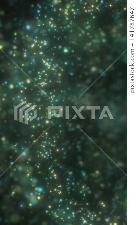 Soft green, teal, and yellow particles floating in a dark atmospheric background with luminous bokeh and dreamy depth. 141787647