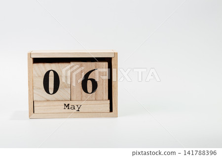 Wooden calendar May 06 on a white background 141788396