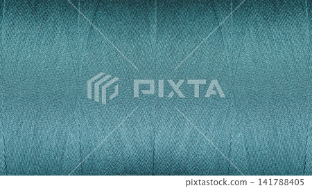 Close-up texture of Blue sewing threads on a spool Close-up texture of Blue sewing threads on a spool 141788405